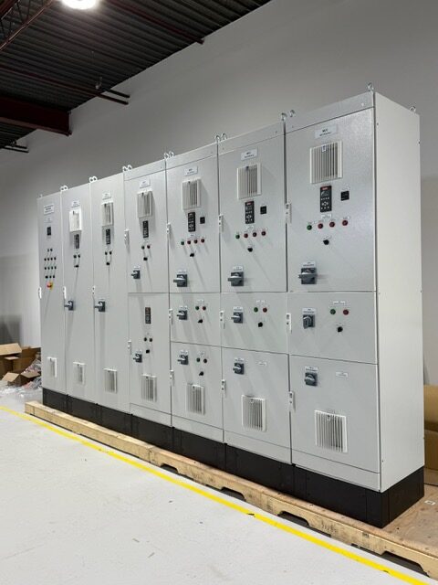 Custom Motor Control Center (MCC) by Exact Control Systems Inc: A UL 508A compliant panel featuring integrated motor starters, modular contactors, and disciplined wiring segregation for high-availability industrial power distribution.